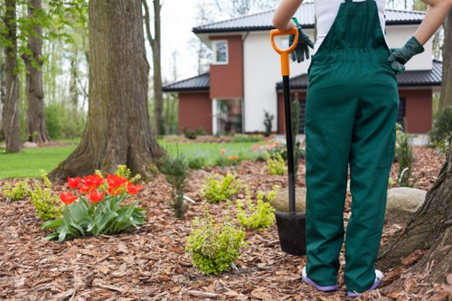 Gardener cordoning off work area to protect public